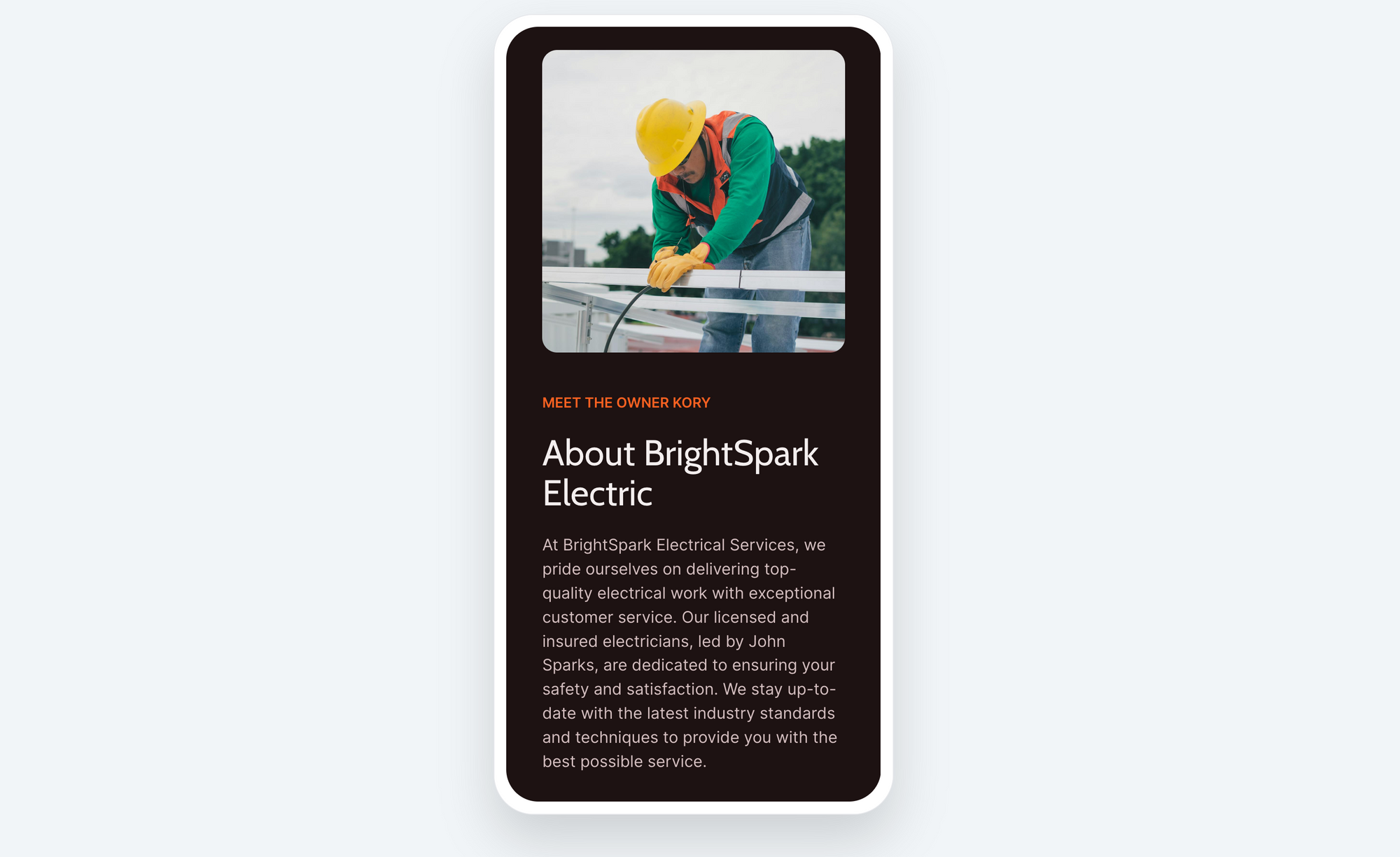 Dark brown site shown on white phone with image of electrician in yellow hard hat