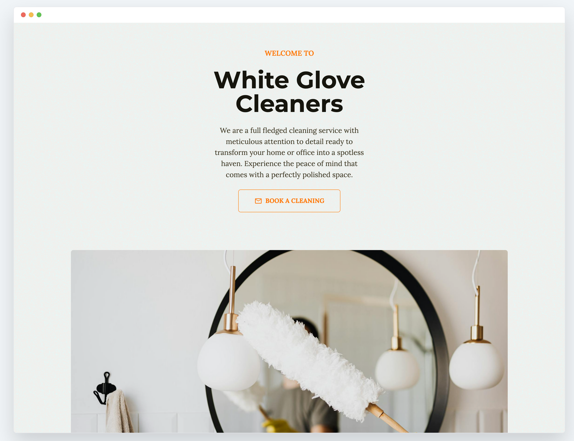 Light website with orange accents and picture of duster on mirror